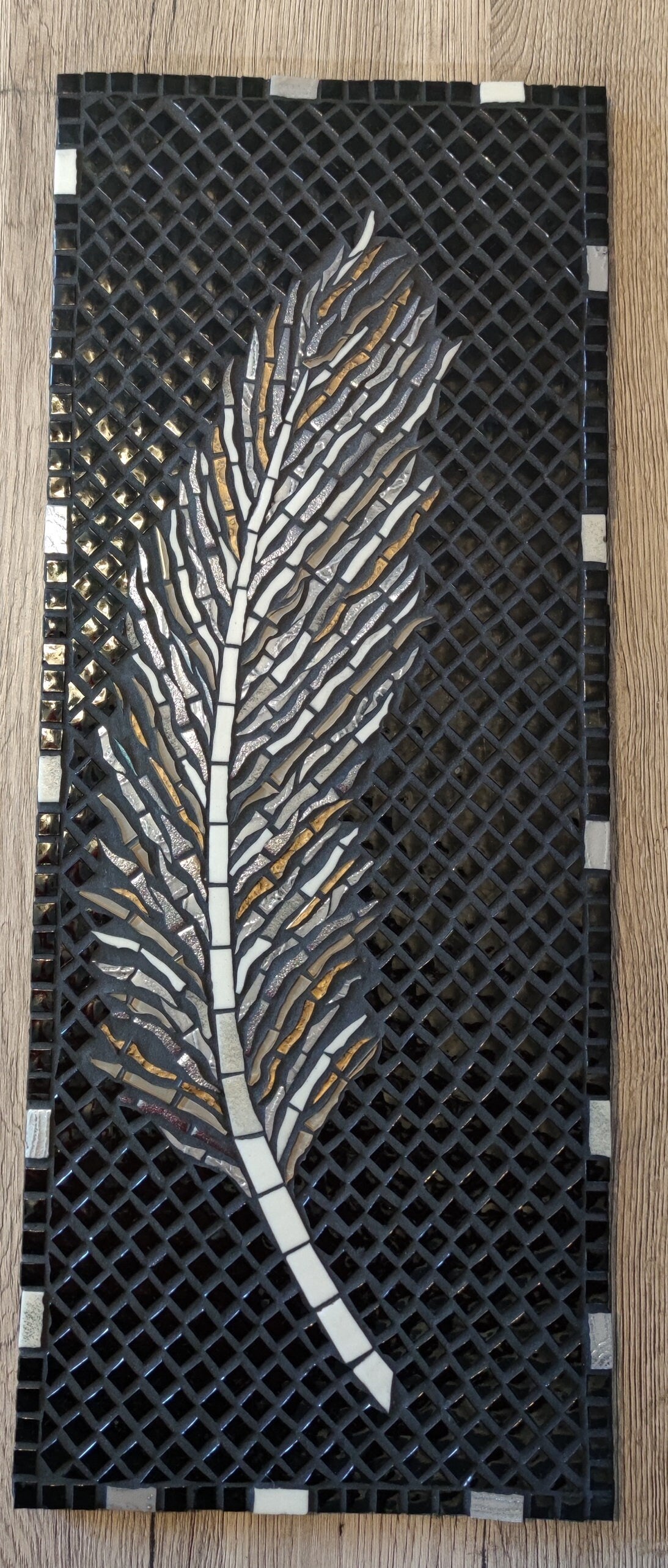 Jolie plume en mosaïque