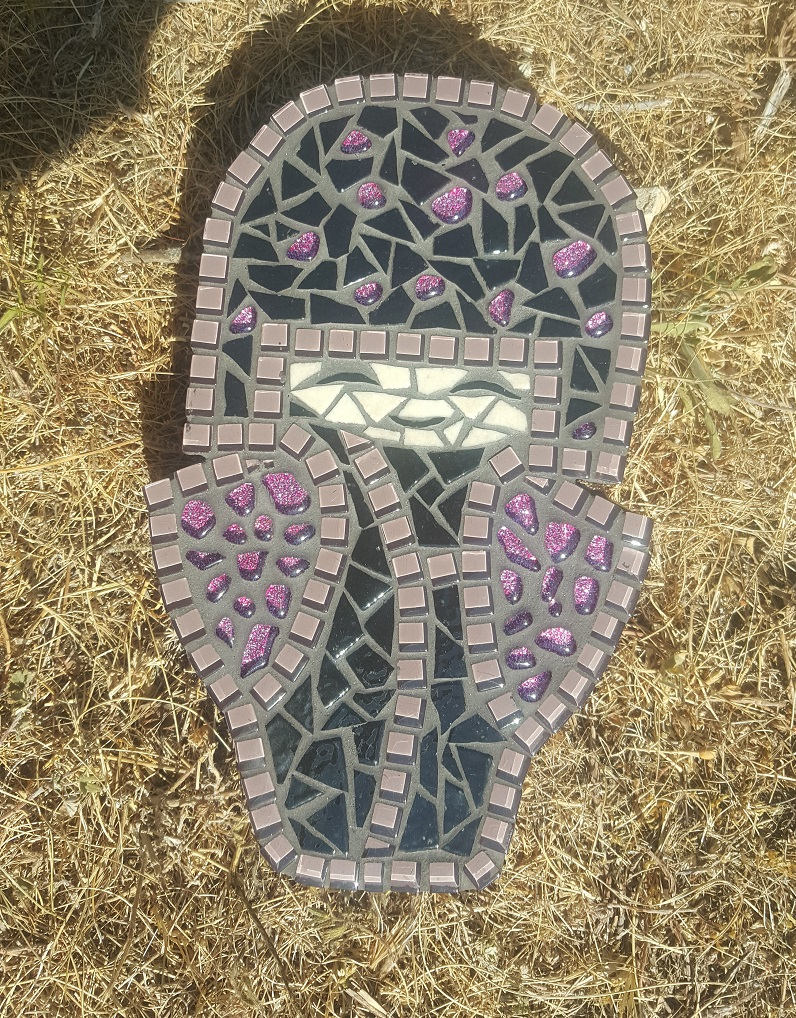 Small Japanese doll in purple and black mosaic